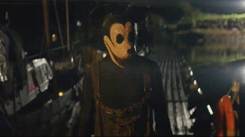 Mickey walks on a pier in Mouseboat Massacre (2025)
