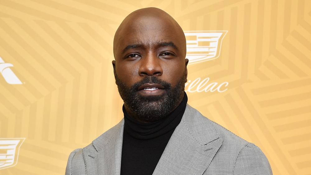 Mike Colter posing in turtleneck