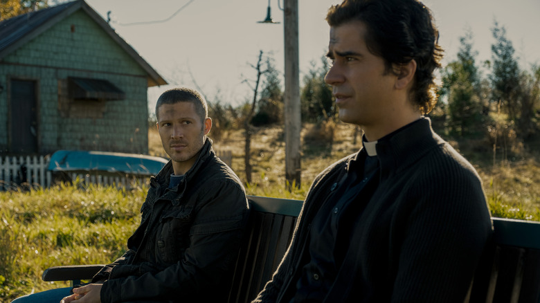 Riley and Paul Hill sitting on bench in "Midnight Mass"