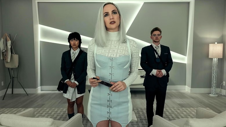 Camille L'Espanaye flanked by two employees in "The Fall of the House of Usher"