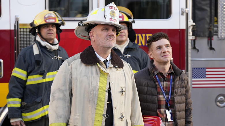 fire chief and jacob standing in front of fire truck