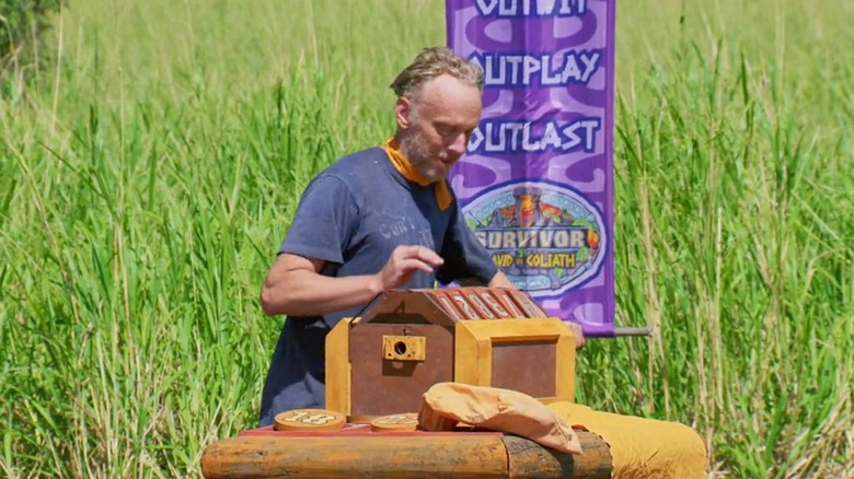 Mike White solving the combination puzzle on "Survivor."