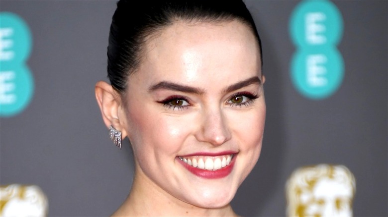 Daisy Ridley smiles for the camera
