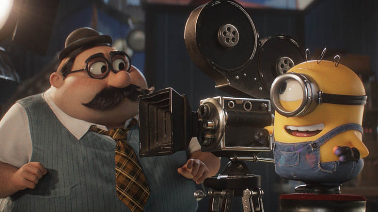 James standing behind the camera next to director