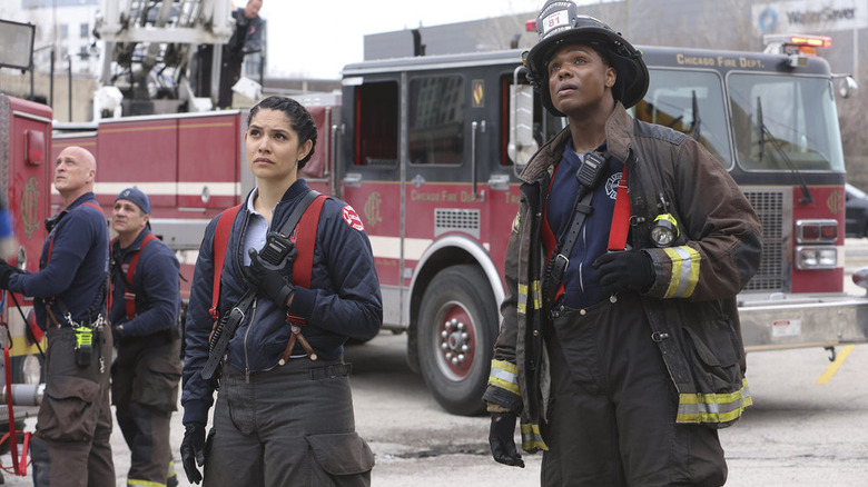 Stella Kidd and Mason standing by fire truck