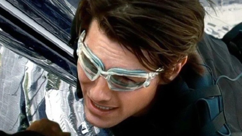 Tom Cruise climbing in Mission: Impossible Ghost Protocol promo art