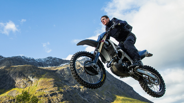 Cruise soars into the air on his motorcycle
