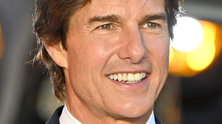 Tom Cruise smiling and looking left