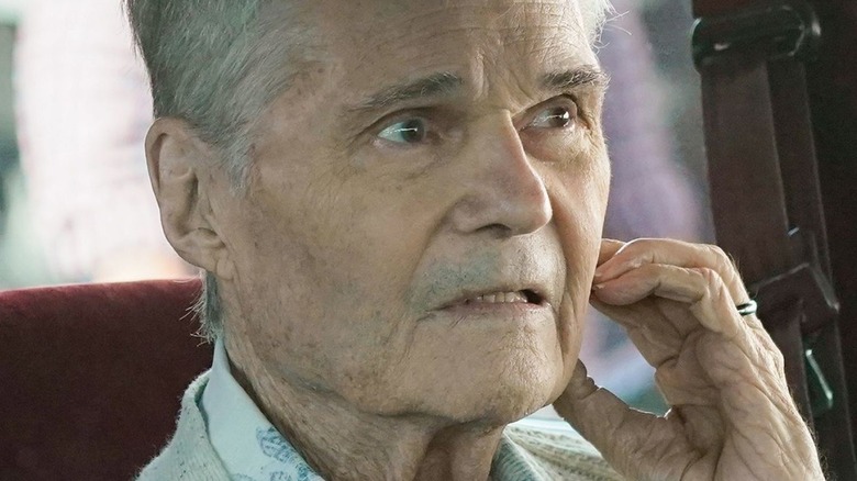 Fred Willard as Frank, driving