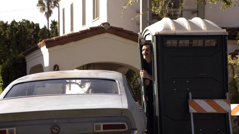 Phil Dunphy trapped in a port-a-potty on "Modern Family"
