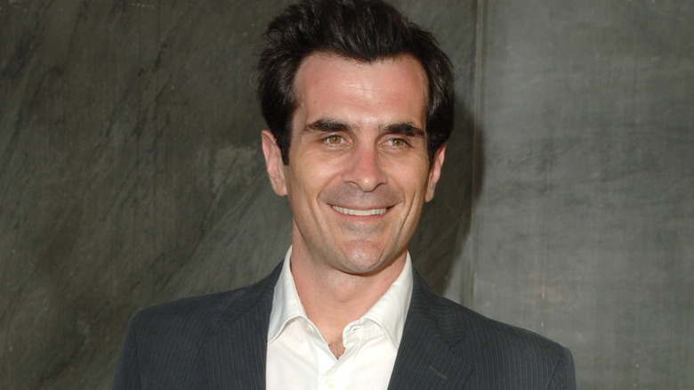 Ty Burrell smiling at a party in 2005