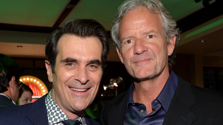 Christopher Lloyd and Ty Burrell smile at event