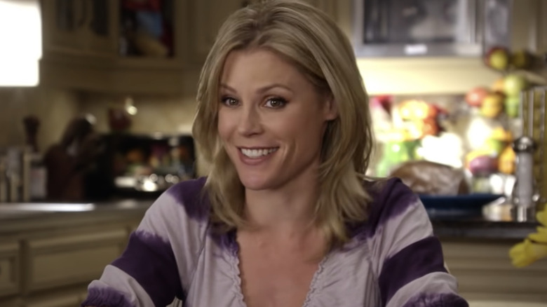 Claire sits and smiles