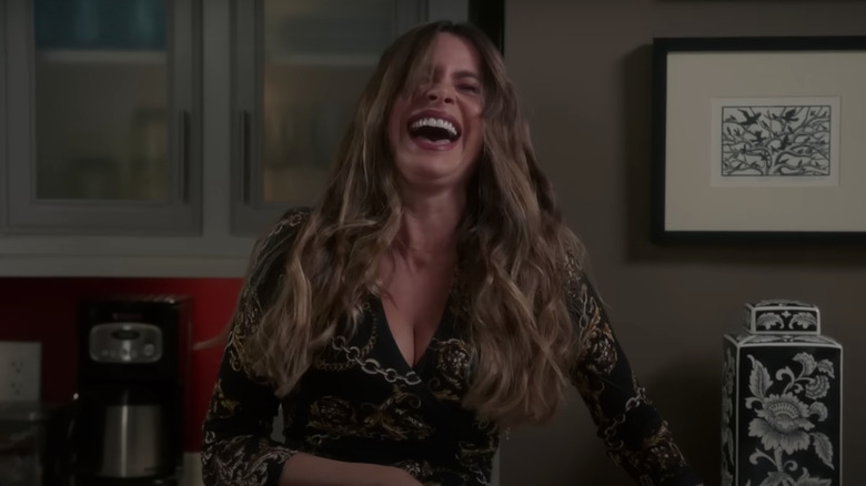 Gloria laughing in the kitchen