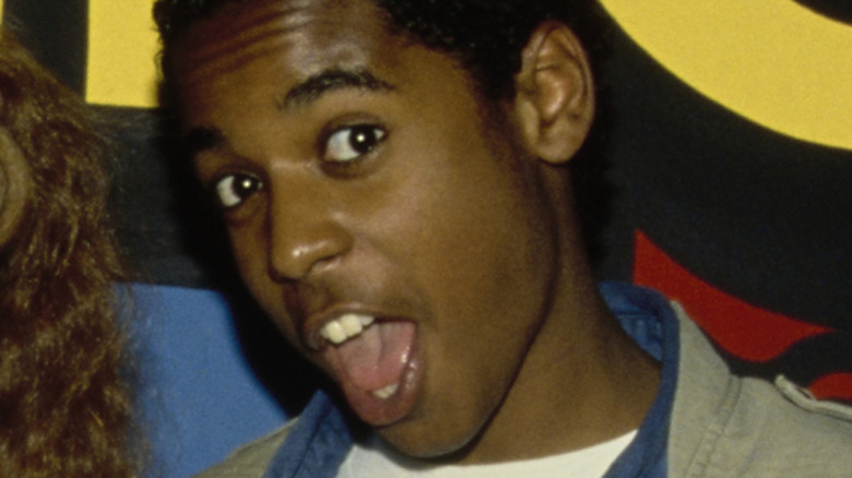 Merlin Santana posing at a red carpet event