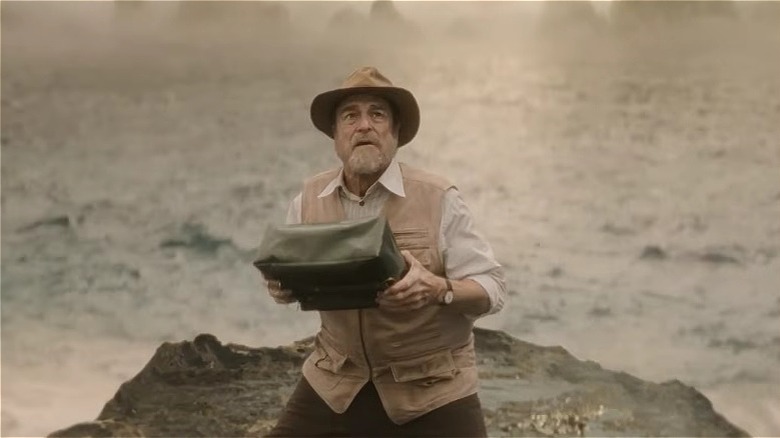 Bill Randa holding a dark bag and looking concerned on Monarch: Legacy of Monsters