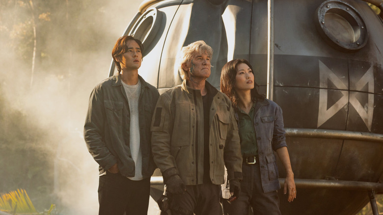 Kentaro Randa, Lee Shaw, and Keiko Miura standing beside a reconnaissance pod on Monarch: Legacy of Monsters