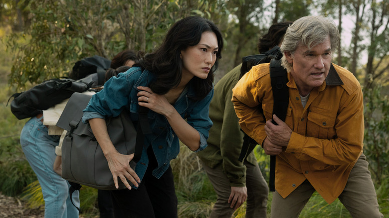 Keiko Miura and Lee Shaw wearing backpacks on Monarch: Legacy of Monsters