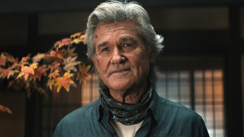 Colonel Shaw wears a blue shirt with a scarf in a Japanese-style room in "Monarch"