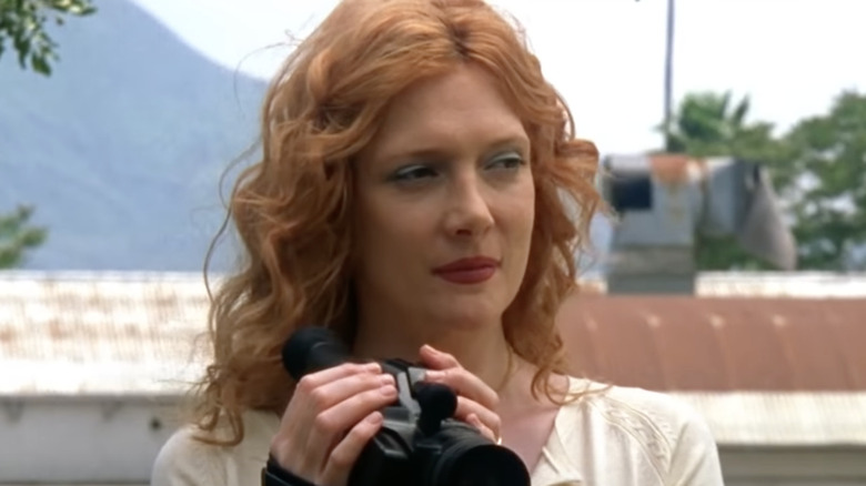 Glenne Headly holds camera