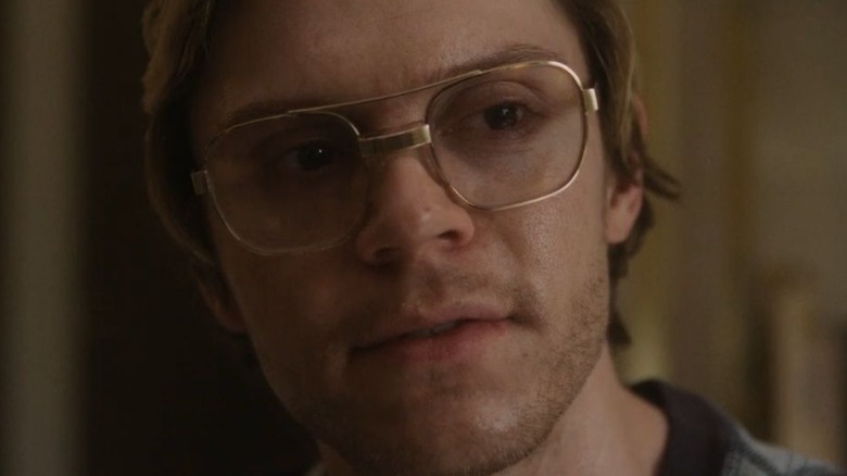 Evan Peters as Dahmer smirking