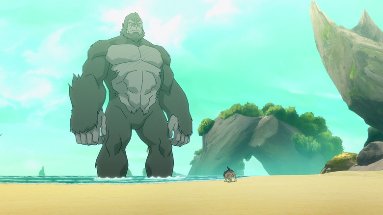 Godzilla towering over a creature on the beach in Skull Island (2023)
