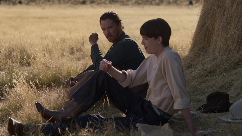 Benedict Cumberbatch and Kodi Smit-McPhee sitting