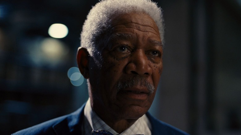 Lucius Fox looking concerned