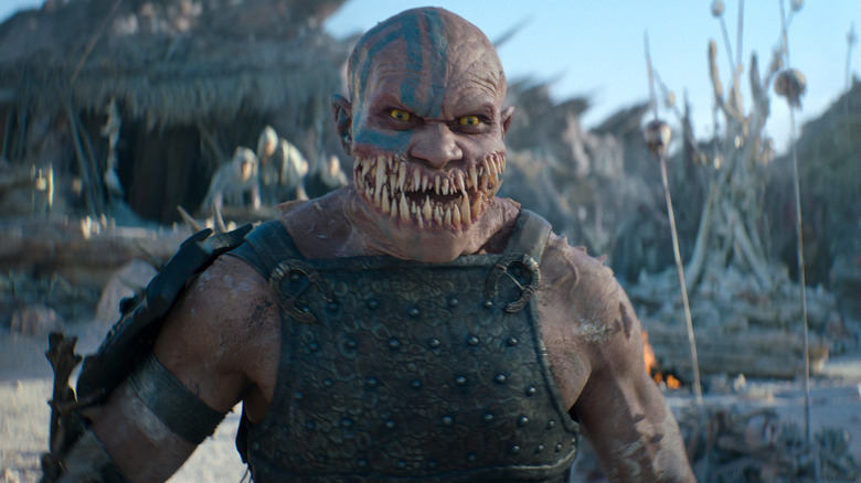 Baraka with blazing eyes and mouth full of fangs in 