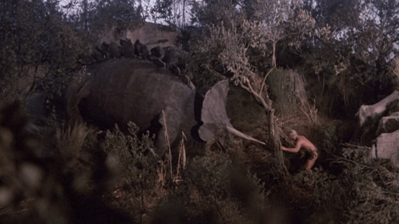 Caveman meets triceratops