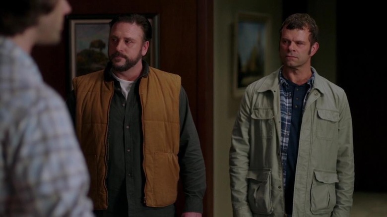 Walt and Roy glaring