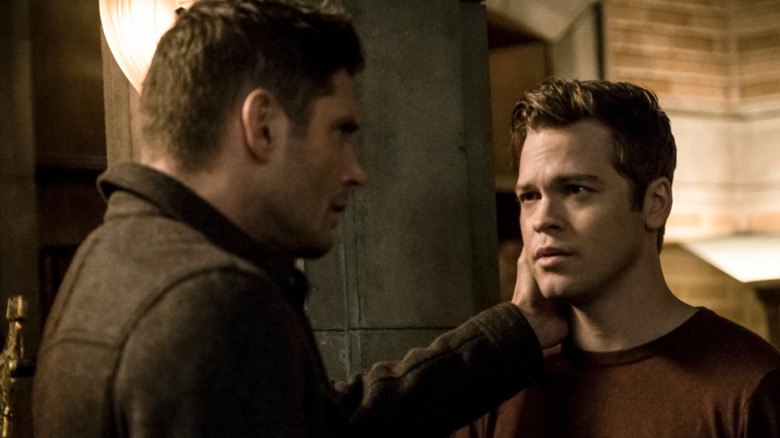 Dean holds Jack's chin