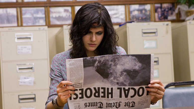 Heather Miller reading newspaper in "Texas Chainsaw 3D" (2013)