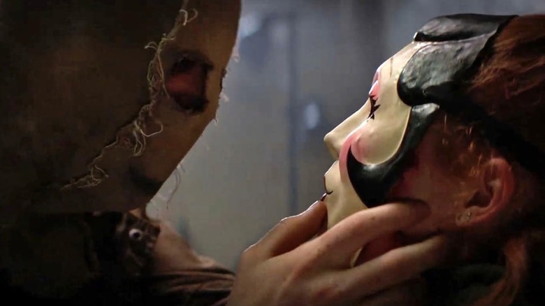 Scarecrow leaning in to Pin-Up Girl in "The Strangers: Chapter 3"