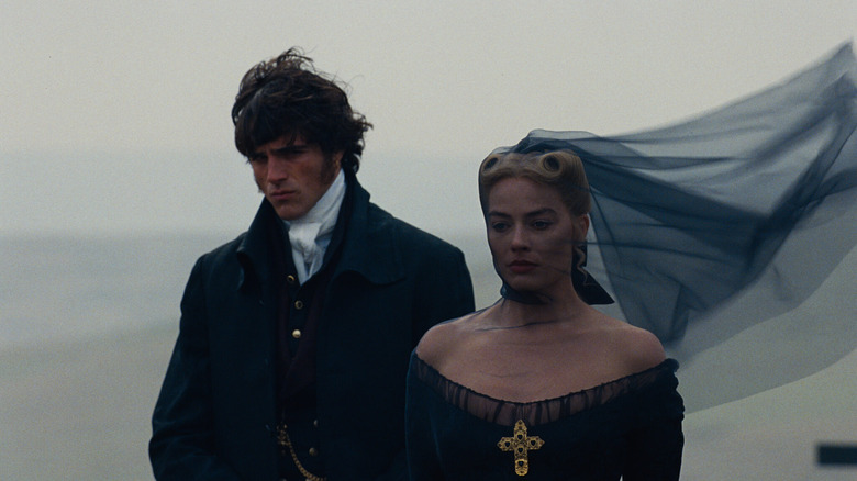 Heathcliff and Cathy standing in the wind in "Wuthering Heights"