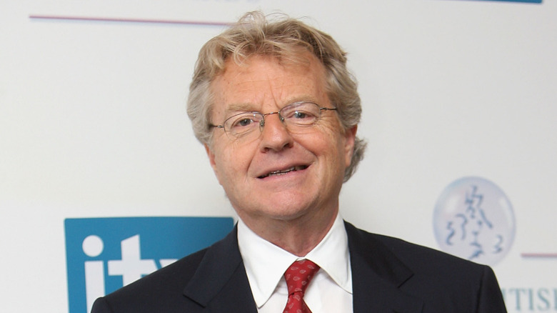 Jerry Springer smiling on a red carpet