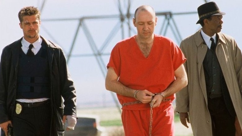 Detectives David Mills and William Somerset escort John Doe in "Se7en"