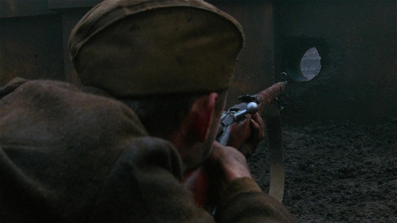 Vassili aiming through wall