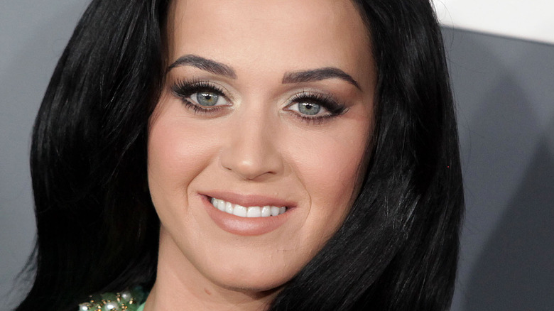 Katty perry smiling with black hair 