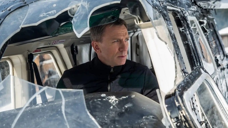 James Bond in a ravaged plane in Spectre (2015)
