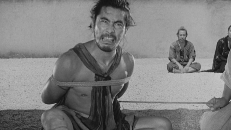 Tajômaru bound on the floor in "Rashomon"