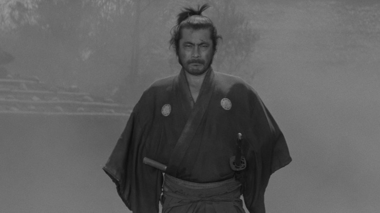 Kuwabatake Sanjuro walking through town in "Yojimbo"