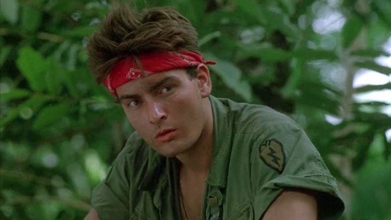 Chris Taylor looking somber in Platoon (1986)