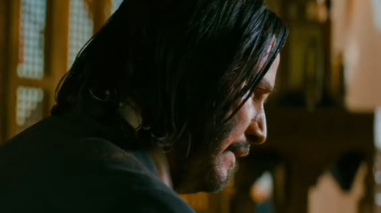 John Wick slicing his finger off