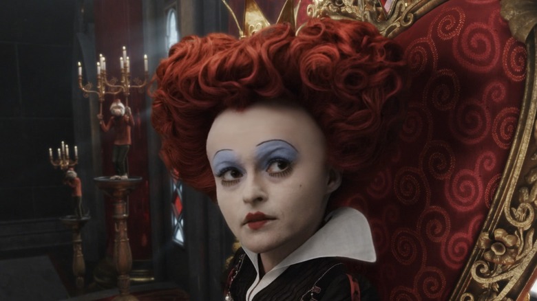 The Red Queen sitting on her throne