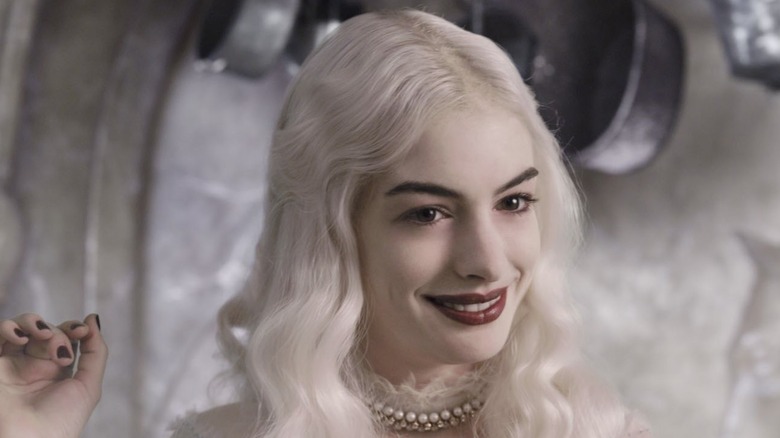 The White Queen smiling at Alice