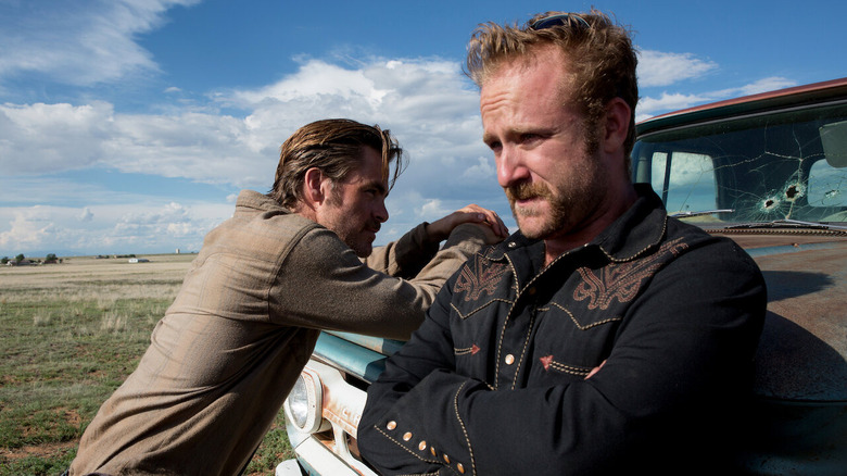 Toby and Tanner leaning against their car in Hell or High Water