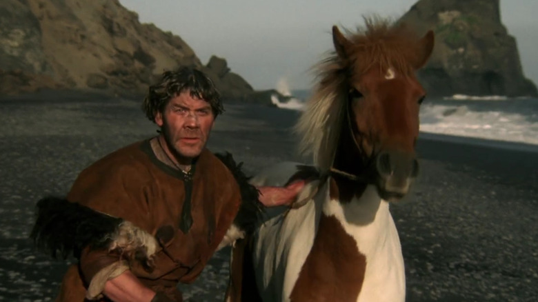 Olaf holding a horse in When The Raven Flies