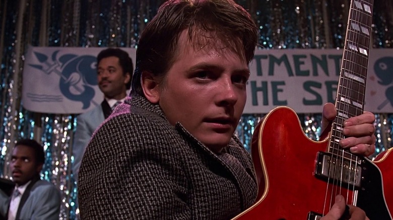 Marty McFly playing a red guitar in Back to the Future