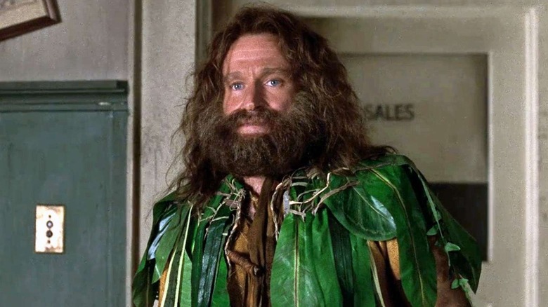 Alan wearing a jacket of leaves in "Jumanji."